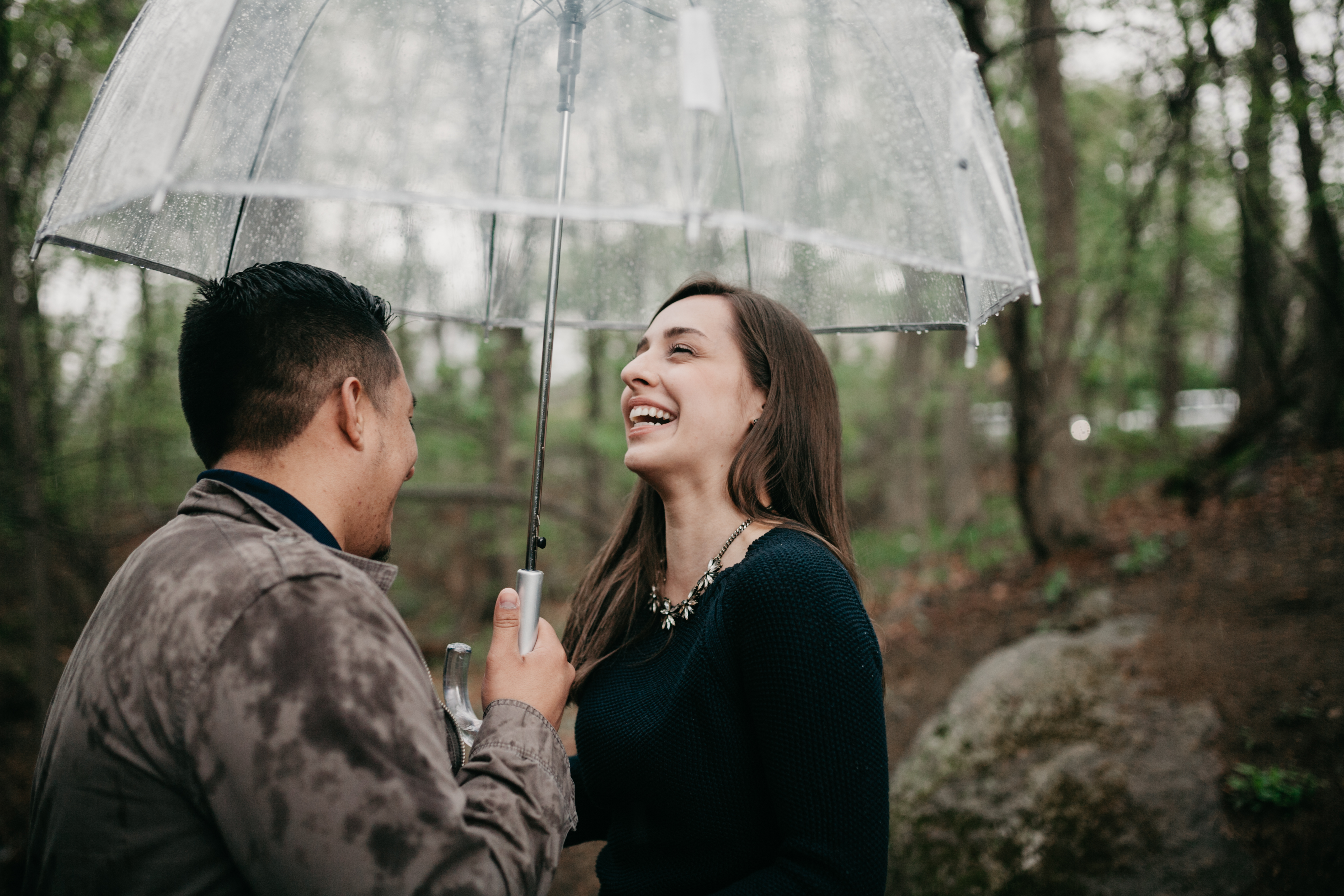 Couple in the rain rainy day engagement session