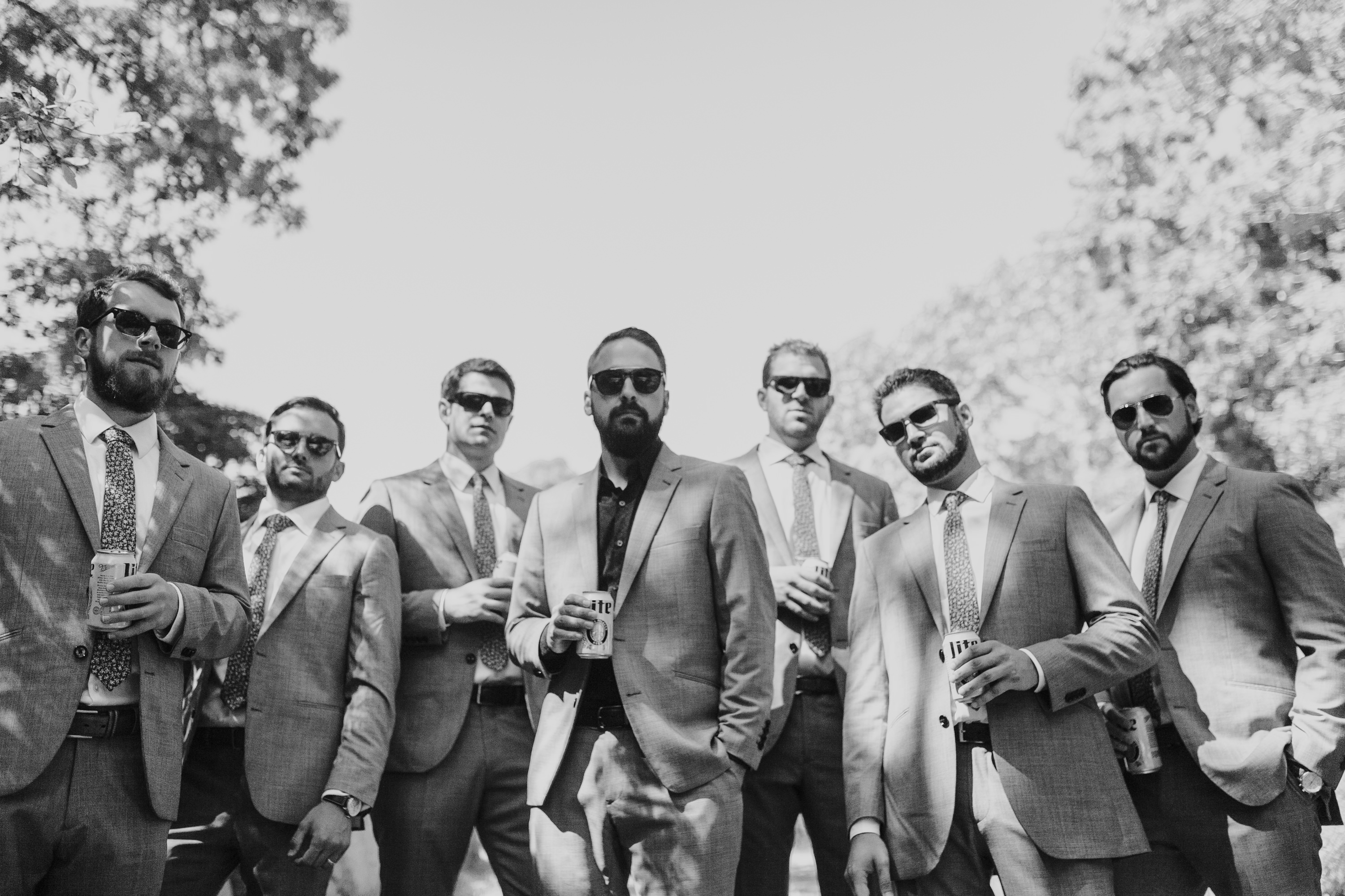 gq, beers bros and sunglasses, black and white picture of groom groomsmen and beer
