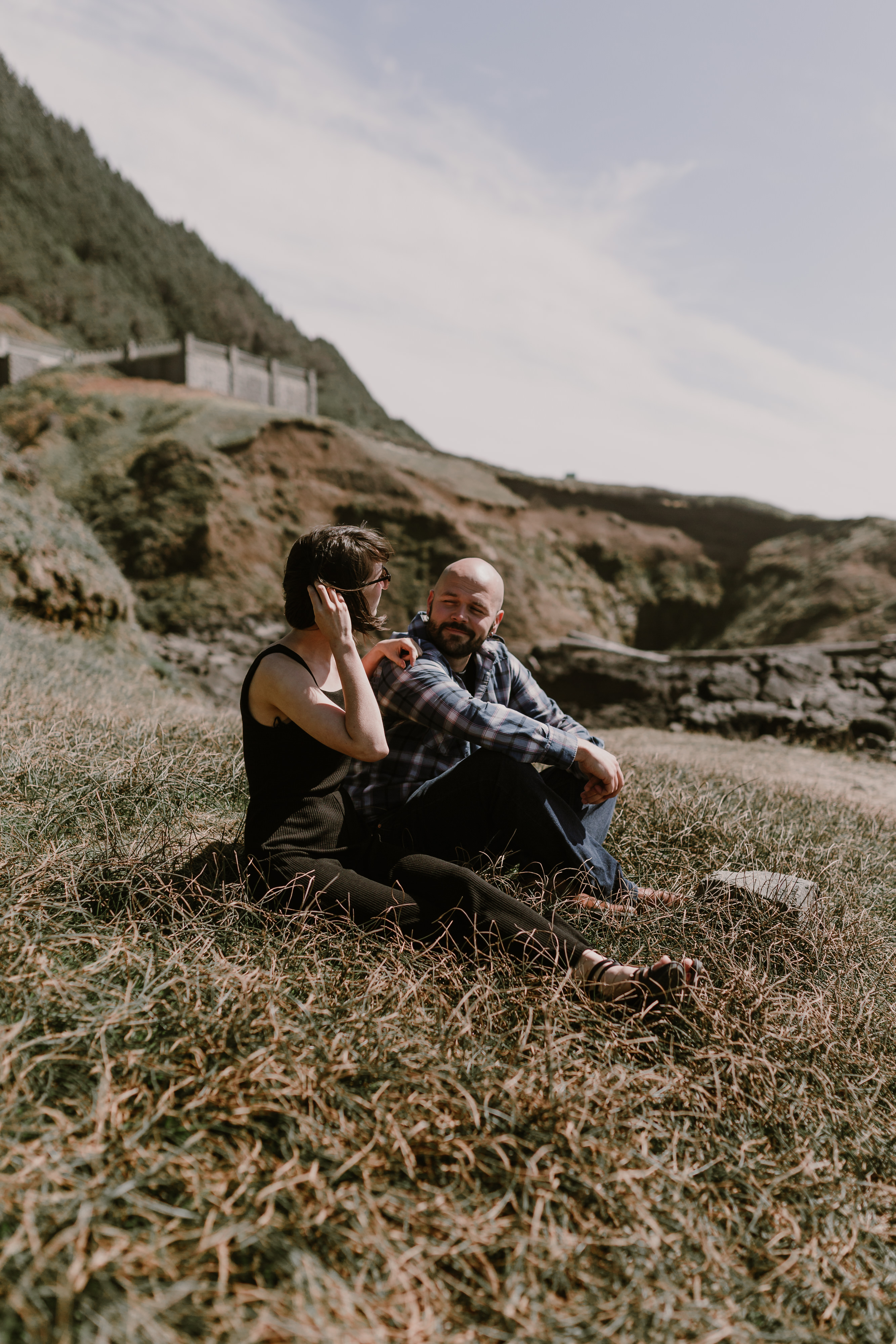 Oregon Coast couple talking in the grass