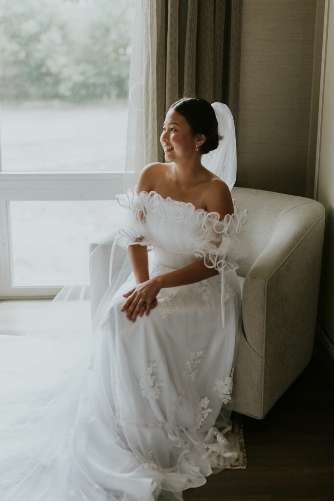Bride sitting in her wedding dress