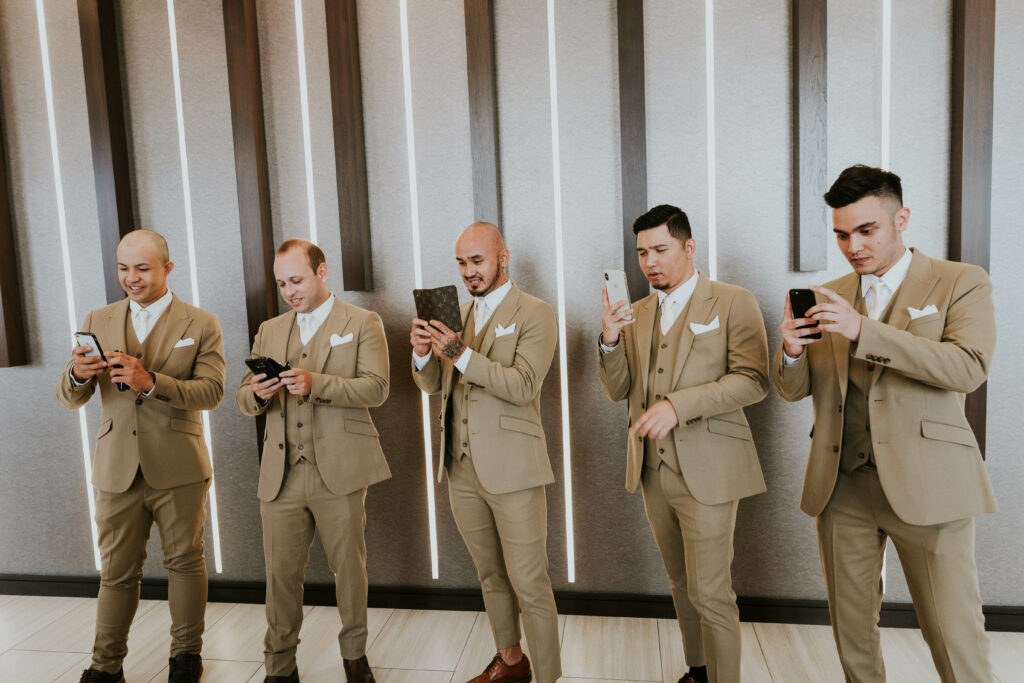 Groomsmen with cell phones 