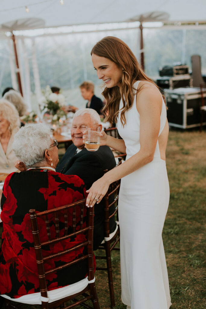 bride mingles with grandparents at her Cape Cod wedding reception