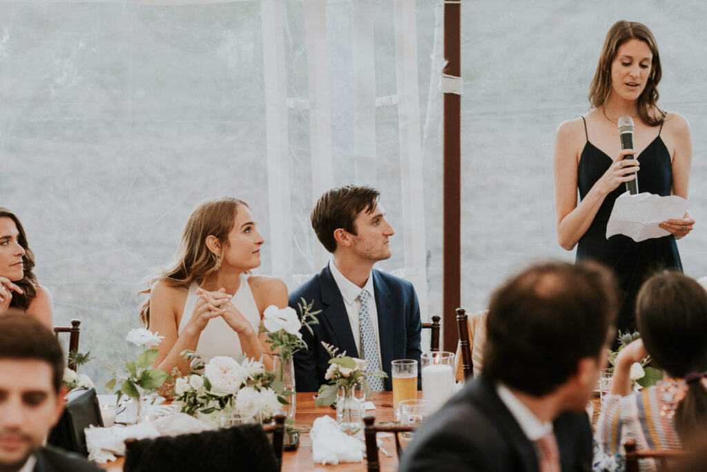 Best Woman delivers speech during outdoor wedding reception in Cape Cod
