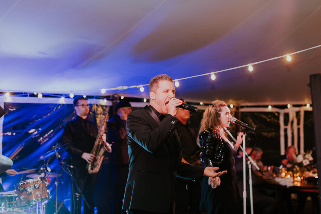 Live band rocks the dance floor during a Cape Cod wedding reception