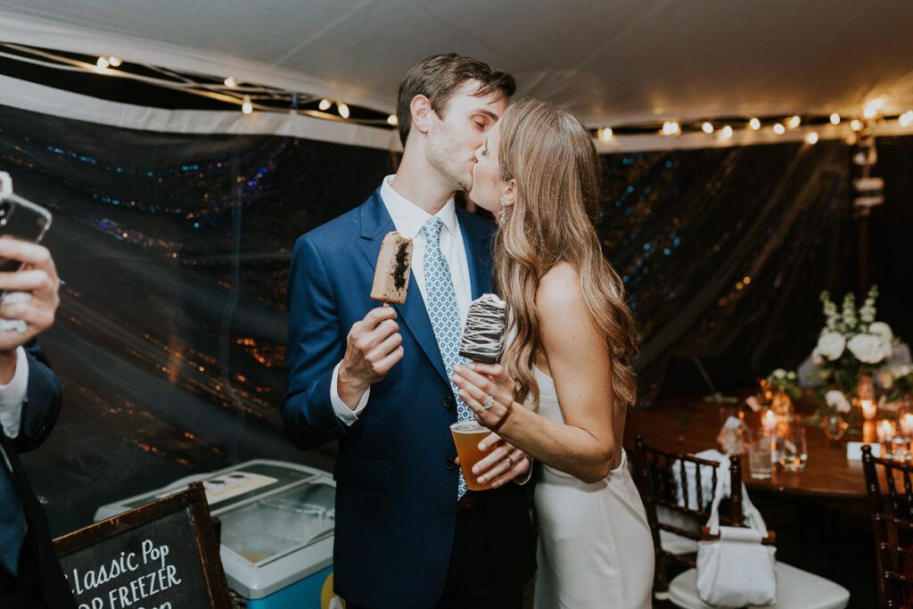 bride and groom eat custom ice cream bars during reception