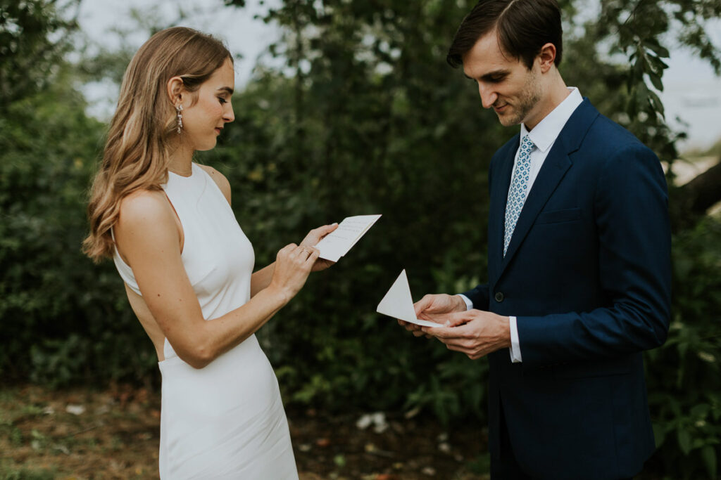 bride and groom open cards from each other after first look